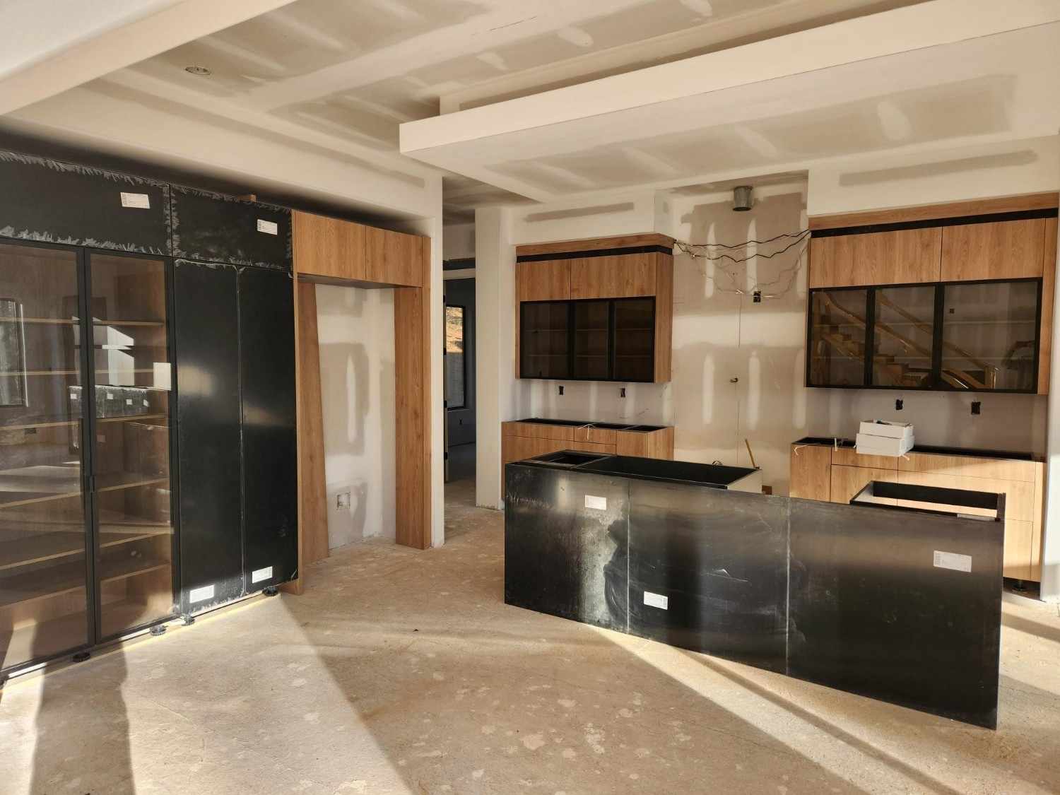 Kitchen remodel in progress showing cabinet and island installation in a modern home in Atlanta, GA